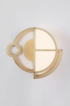 Moonrise wall sconce 1 in gold in a studio image.