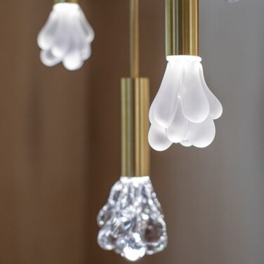 A close-up of a cluster of Dew suspension lights in both transparent and etched glass.