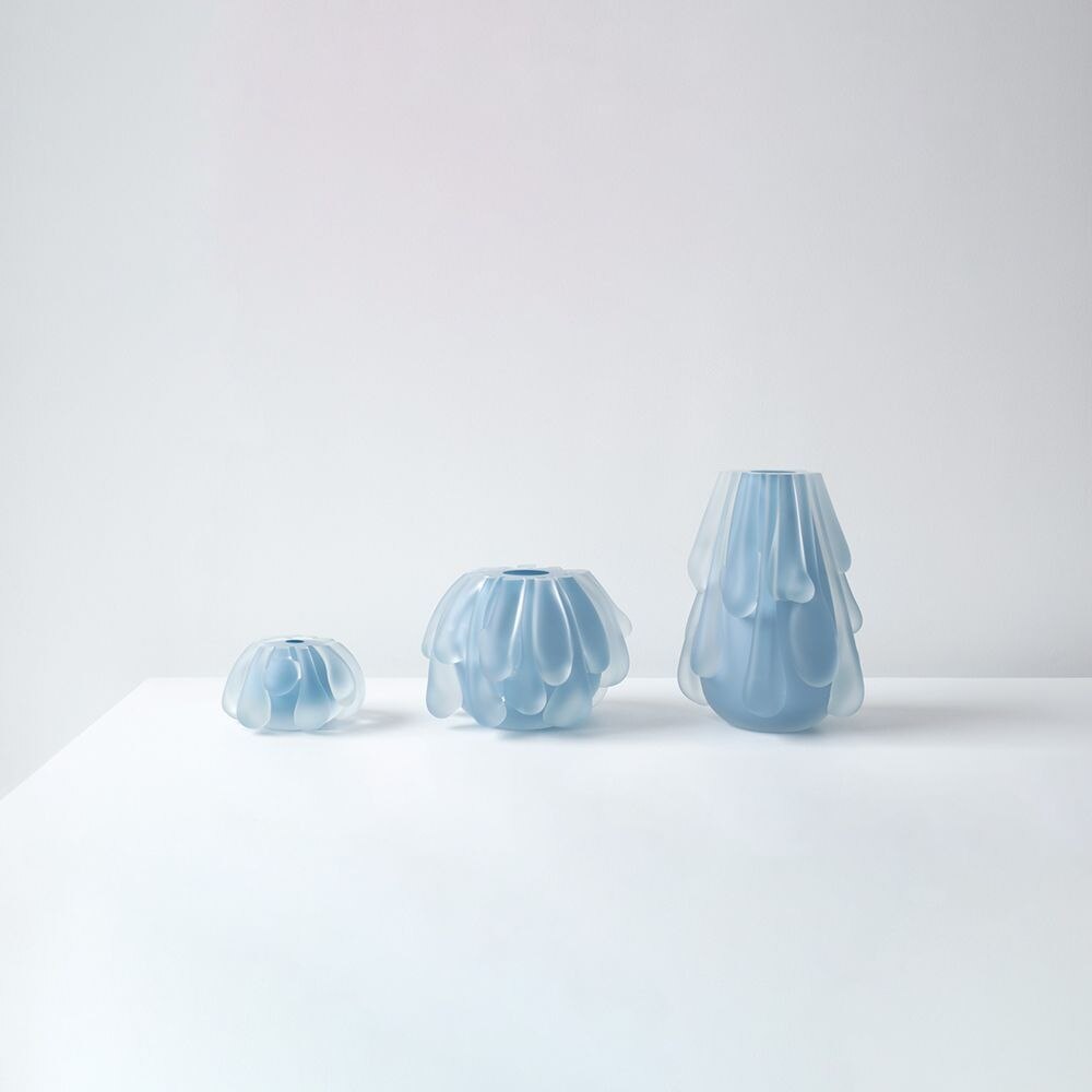 From left: Glo-Ball Suspension from Flos, designed by Jasper Morrison; a cluster of ​​Gregg Suspension Lights from Foscarini, designed by Ludovica & Roberto Palomba