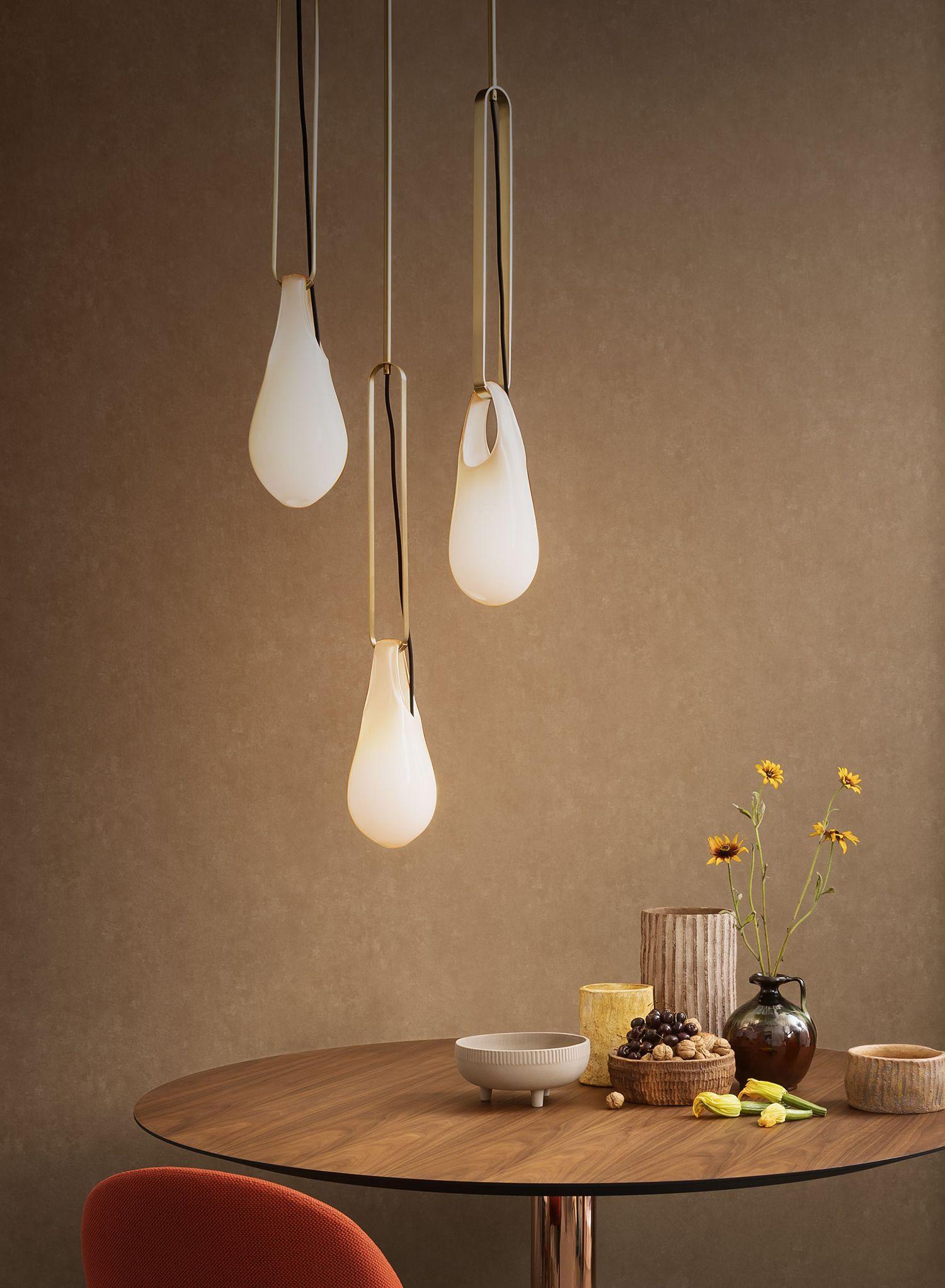 A cluster of the Hold Pin Suspension above a kitchen table