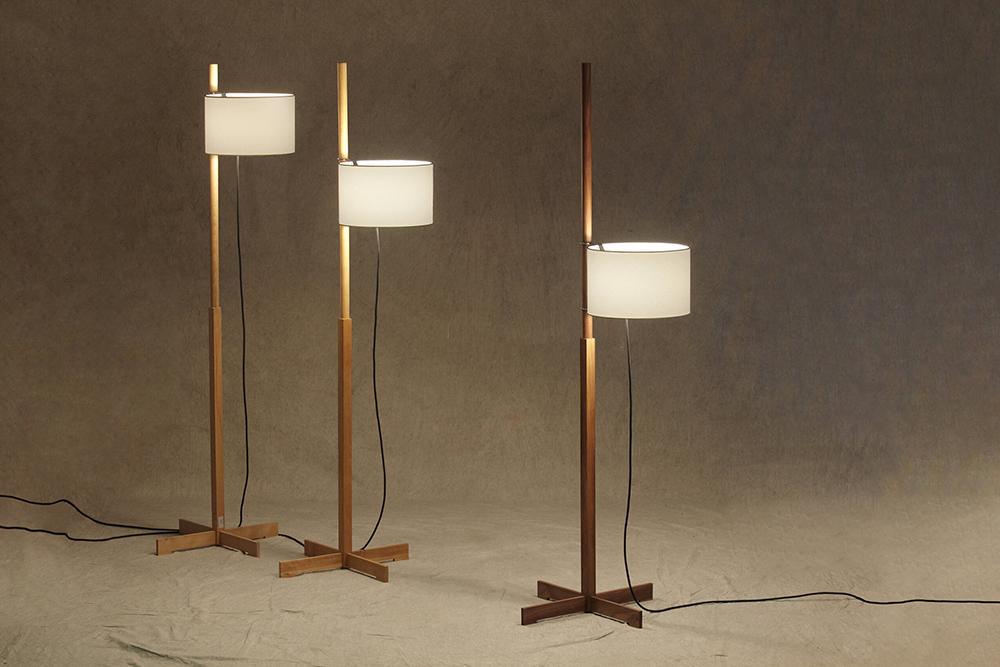 Three TMM Floor Lamp models in differing wooden structures. This collection features 3 basic components: the structure, the electrical parts and the shade. The light source is cleverly designed to rotate around the shaft and can be raised or lowered like a flag on a mast.