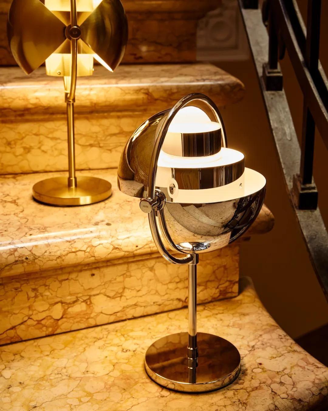 Two Multi-Lite Portables on a staircase, showing the different ways to adjust the shades