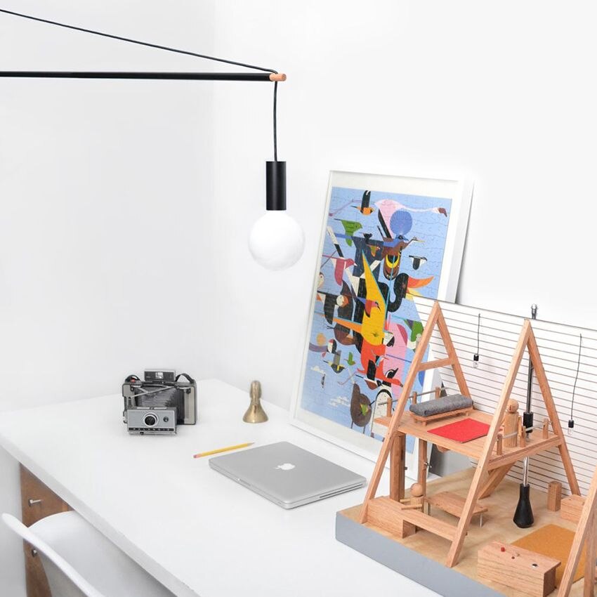 From left: Crane Light Wall from Stuff by Andrew Neyer above a tidy work desk; a living room vignette with the Mantis BS2 Wall Light from DCW éditions
