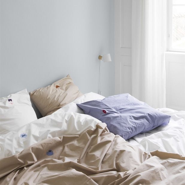 From left: Plug-in lights like the Alumina Wall from Tala and the Rise Wall from Normann Copenhagen are great solutions for adding layered lighting in bedrooms.