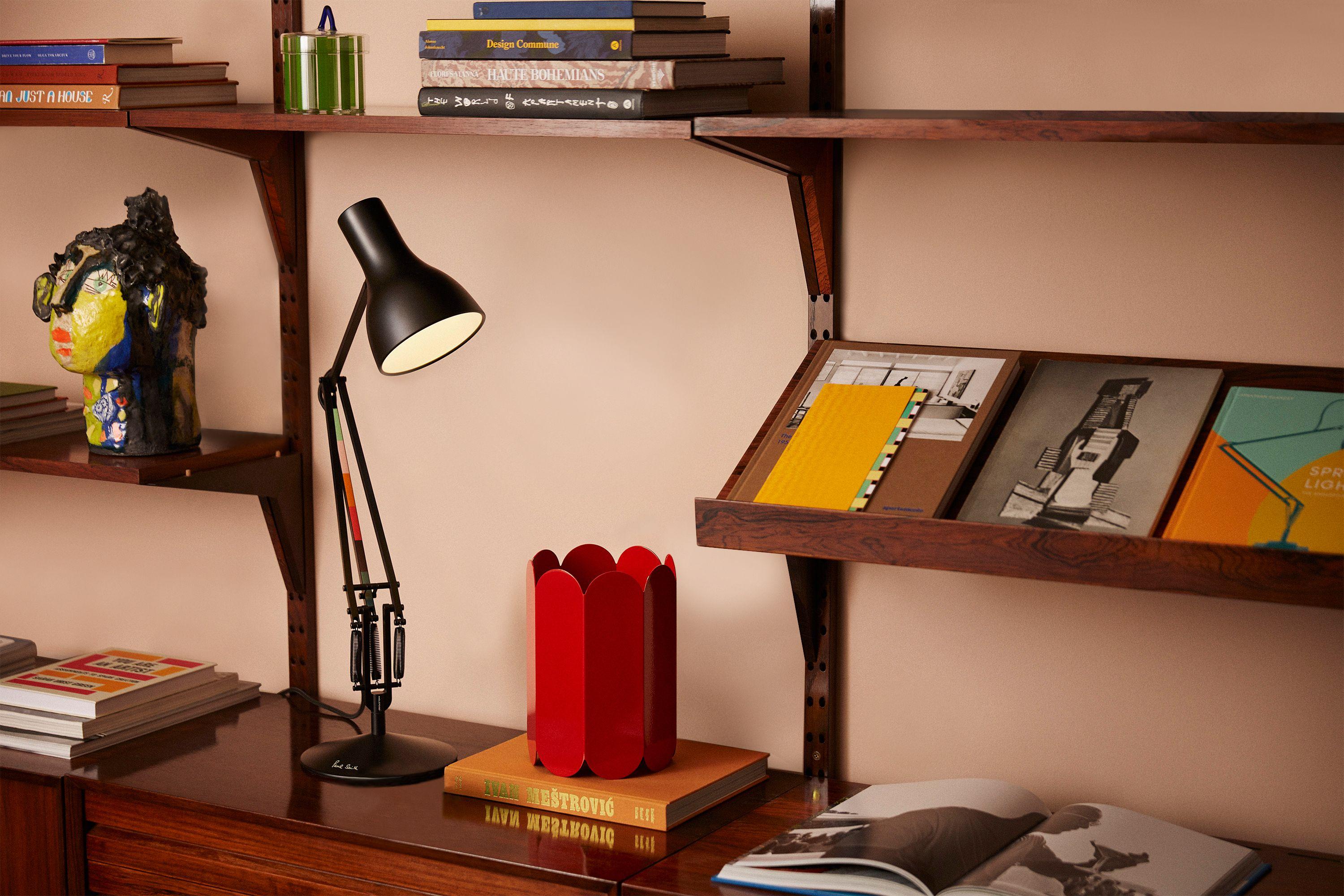 British fashion designer Margaret Howell working at her desk, illuminated by the special Margaret Howell Edition of the Type 75™ Desk Lamp in yellow ochre