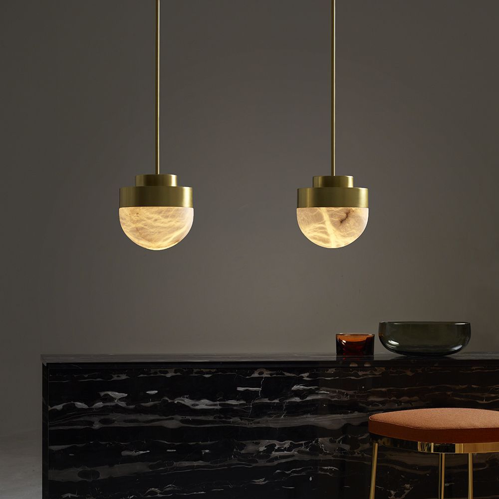 Bask in the rich glow of CTO Lighting through alabaster diffusers in their Lucid Collection.