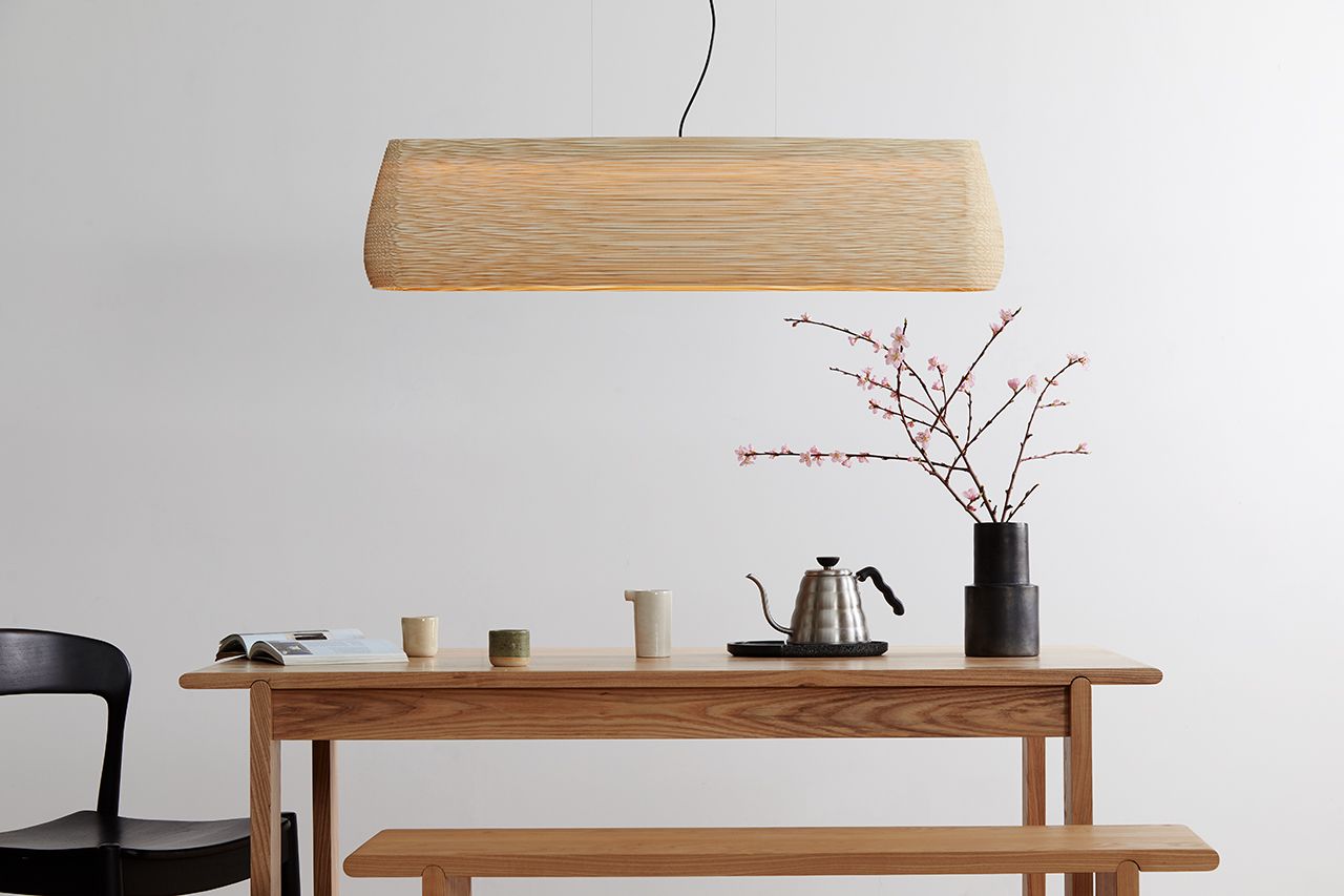 Graypants' Scraplights Collection is crafted from recycled cardboard and assembled by hand with non-toxic adhesive, showcasing warm down-lit fixtures with organic, rounded silhouettes designed to emit an intimate ambient glow.