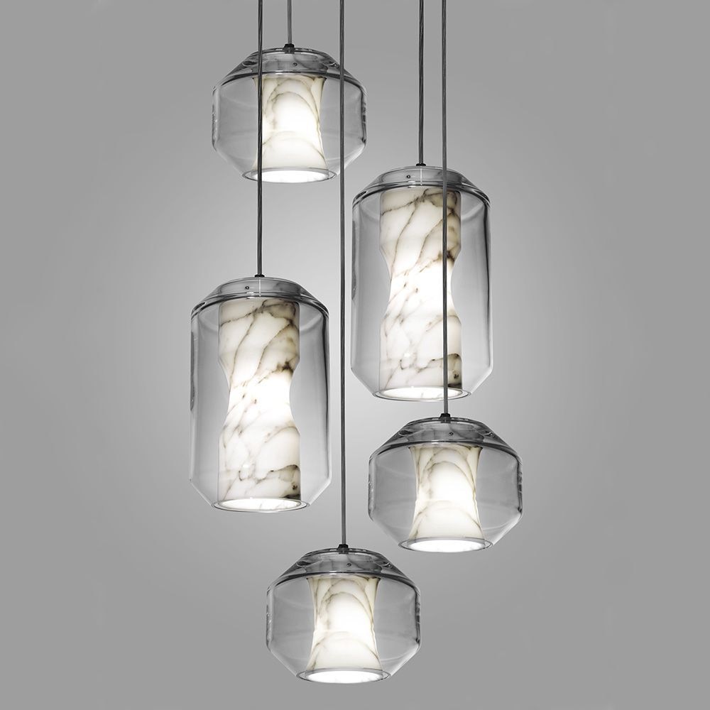 The Chamber from Lee Broom combines a sculptural Carrara marble diffuser within a lead crystal vessel, showcasing the unique translucent qualities of marble in a striking pendant. Enjoy its gentle luminosity and directional downward light.