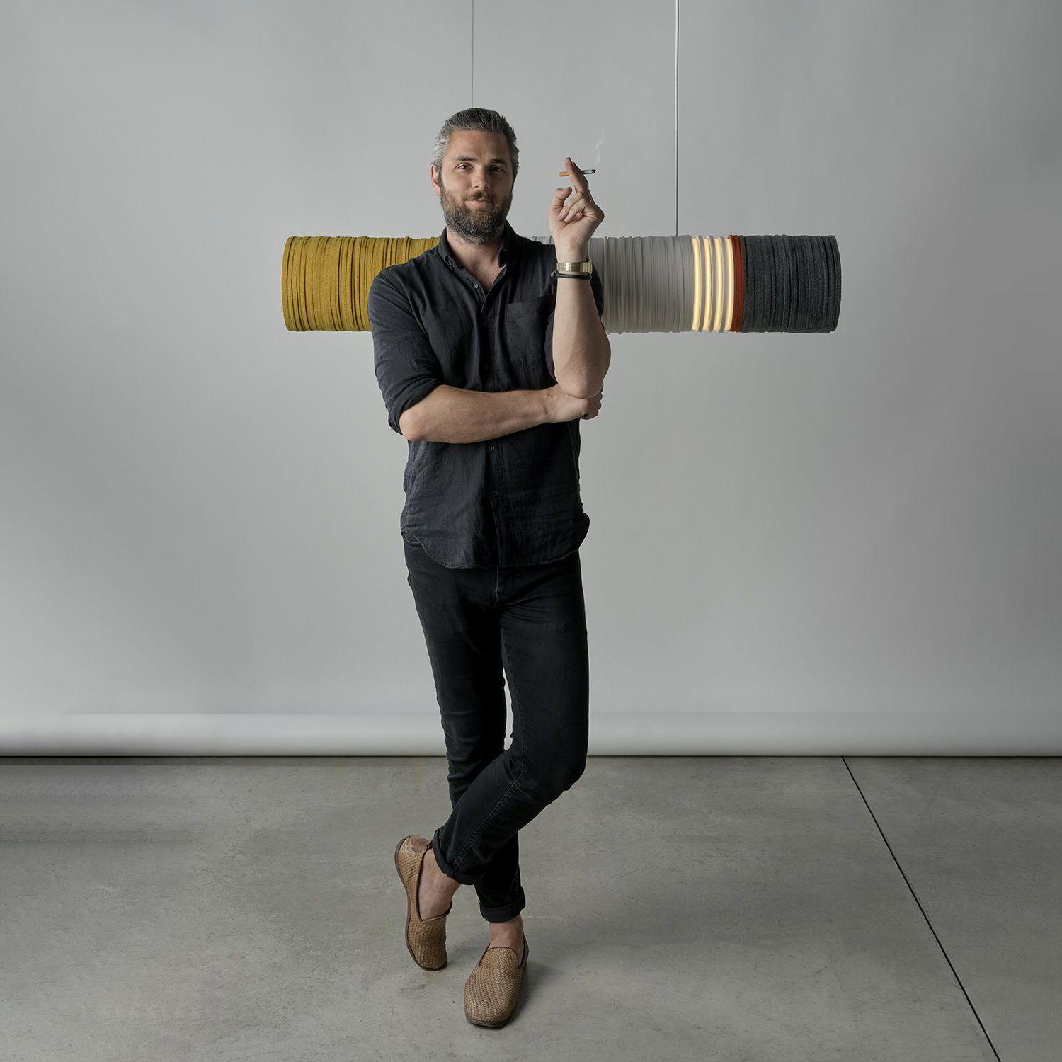 Jeff Forrest posing with a cigarette in front of 2020 Cigarette Suspension
