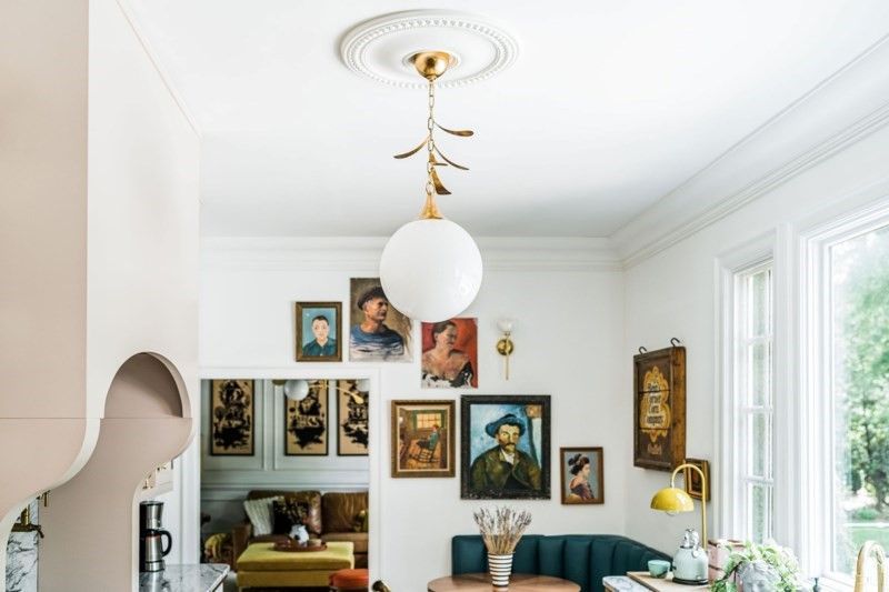 The Victoria Pendant from Mitzi in an eclectic space, filled with cherished pieces collected over time.