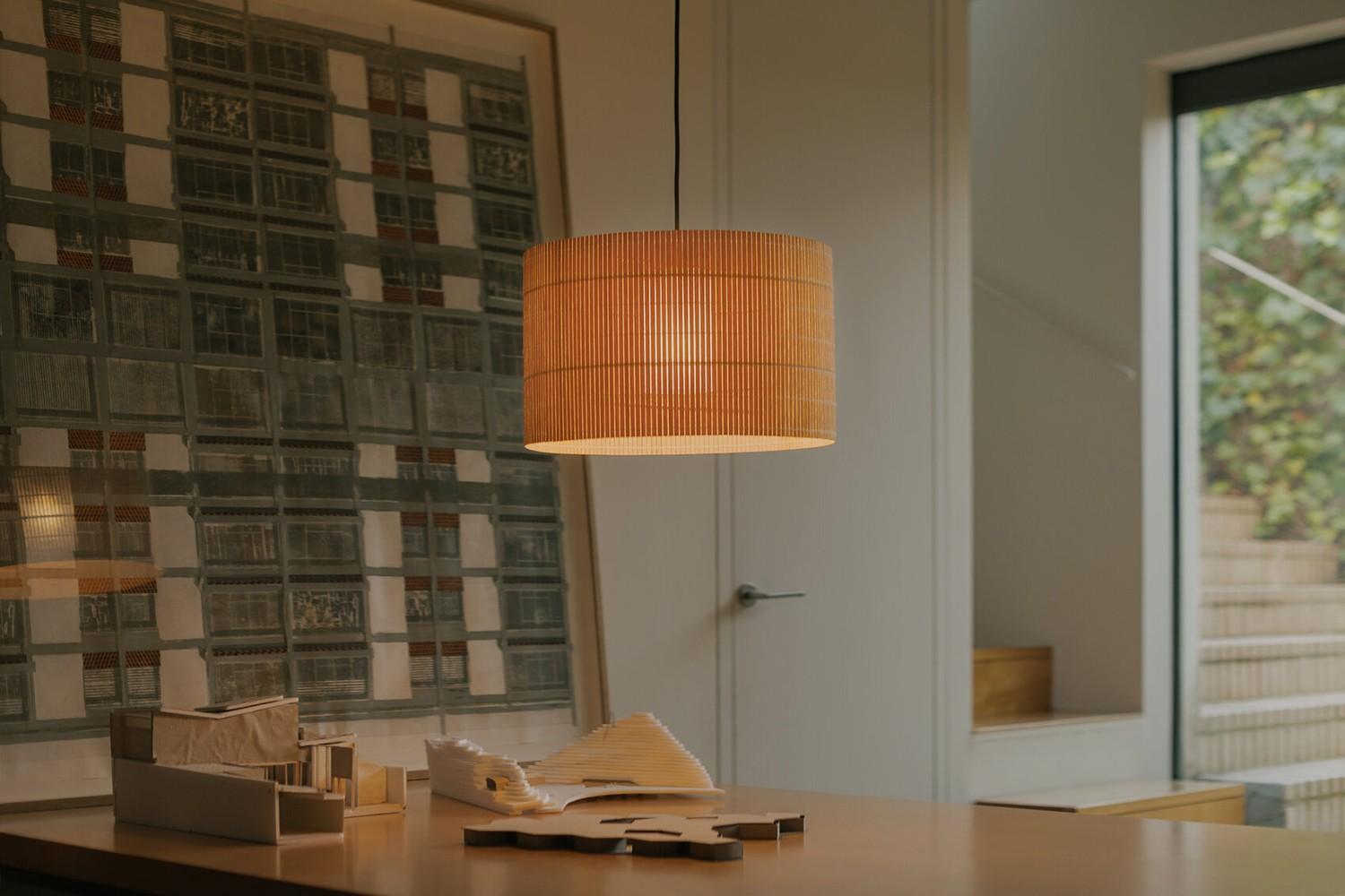 The Nagoya Suspension from Santa & Cole features a textured wood shade made of poplar.