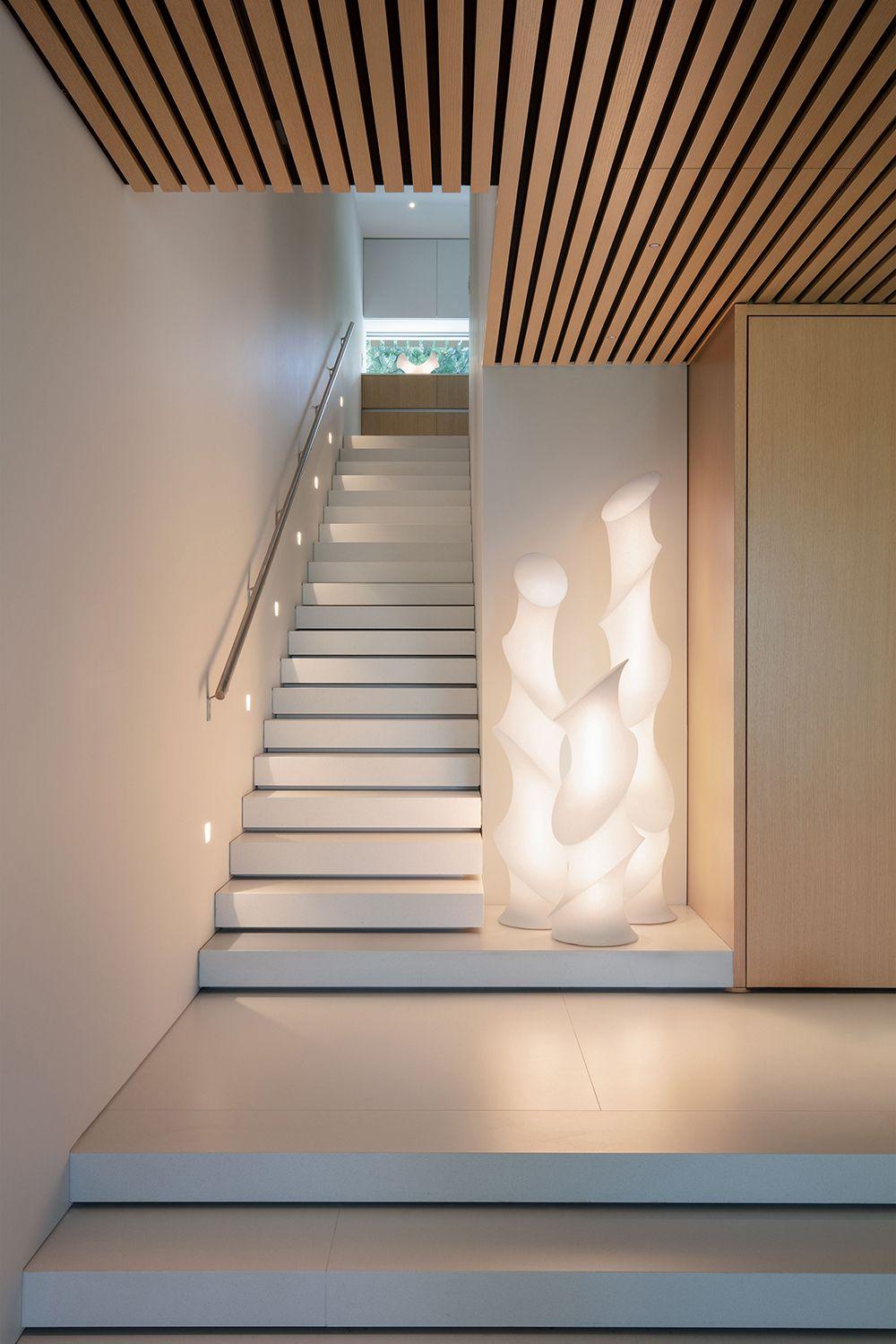 The Minima Series in varying heights clustered together to make a statement impact near a stairwell