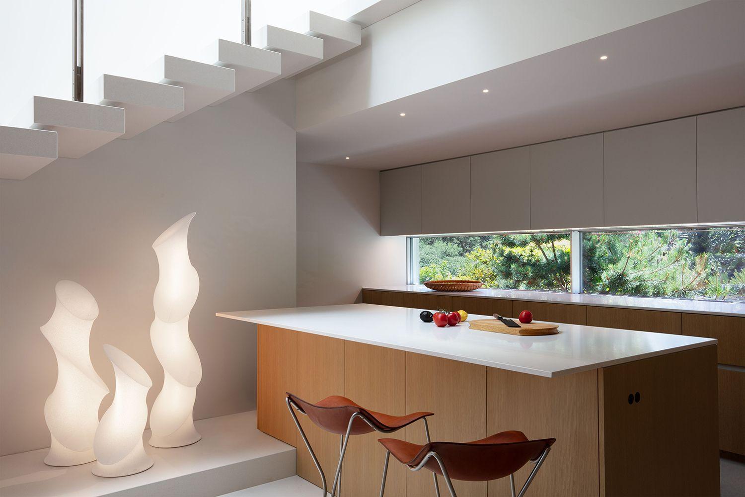 The Minima Series in varying heights clustered together in a kitchen setting