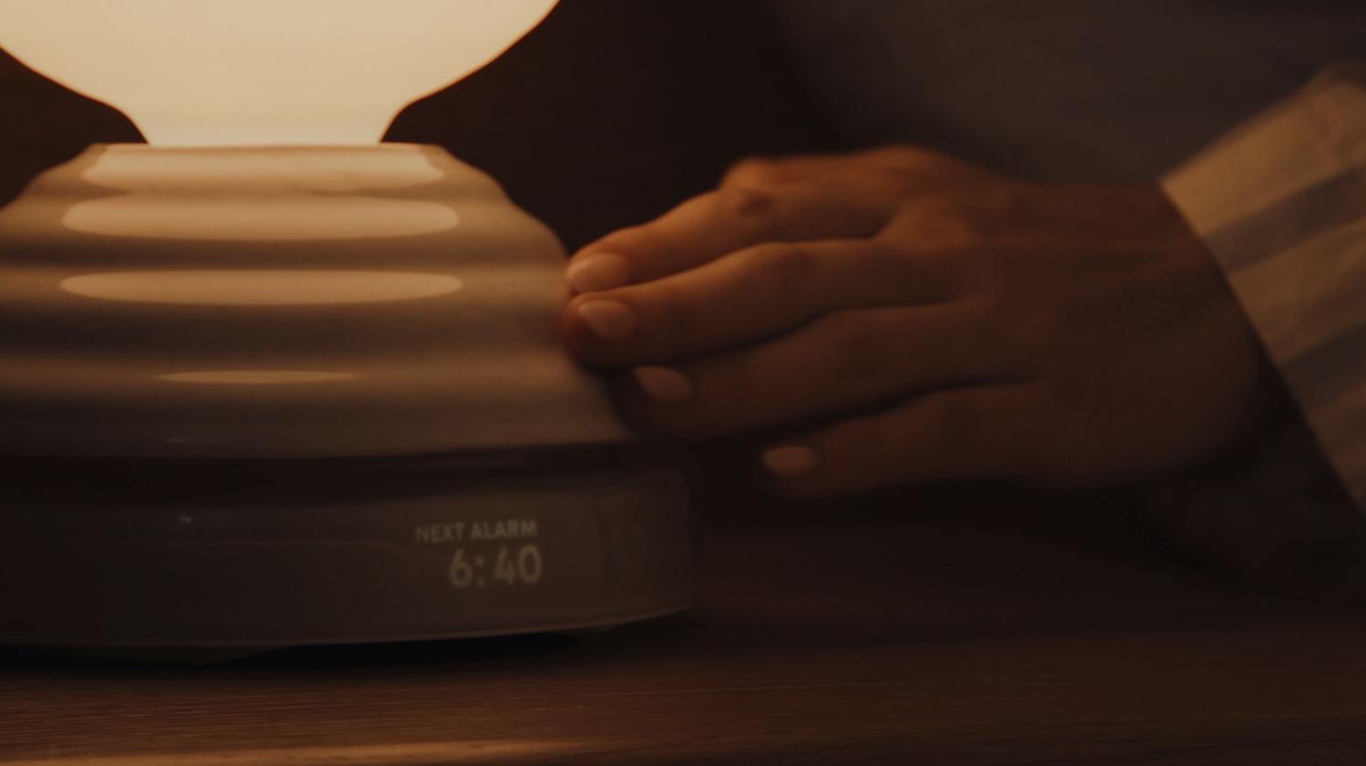 A serene and minimalist living space illuminated by the Cesta Metallica Table Lamp (left) and Babel Table Lamp (right) from Santa & Cole.