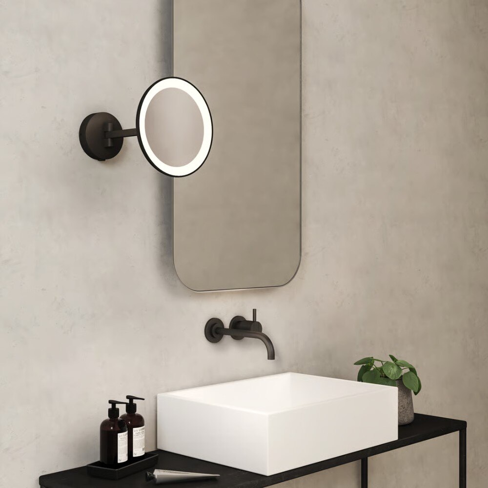 Mascali Wall Lights in matte black (left) and polished chrome (right).
