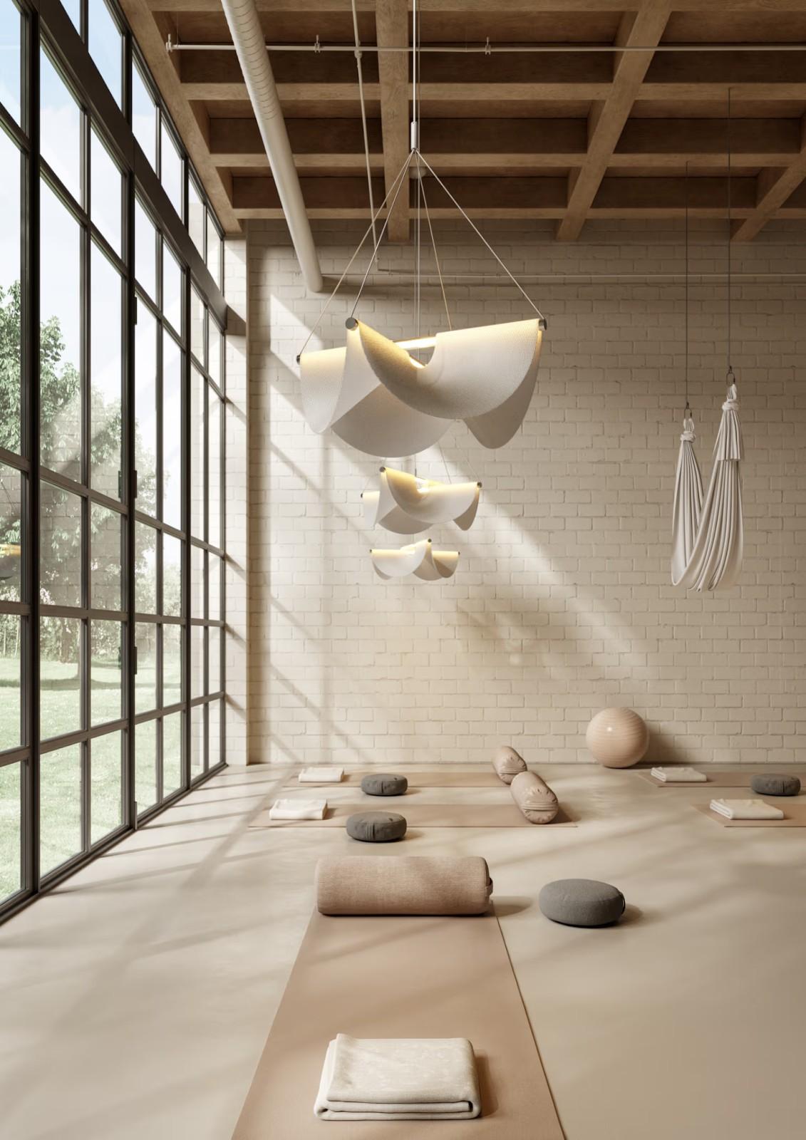 Moooi’s Drape Suspension Lights in a movement studio (left) and above a dining table (right).