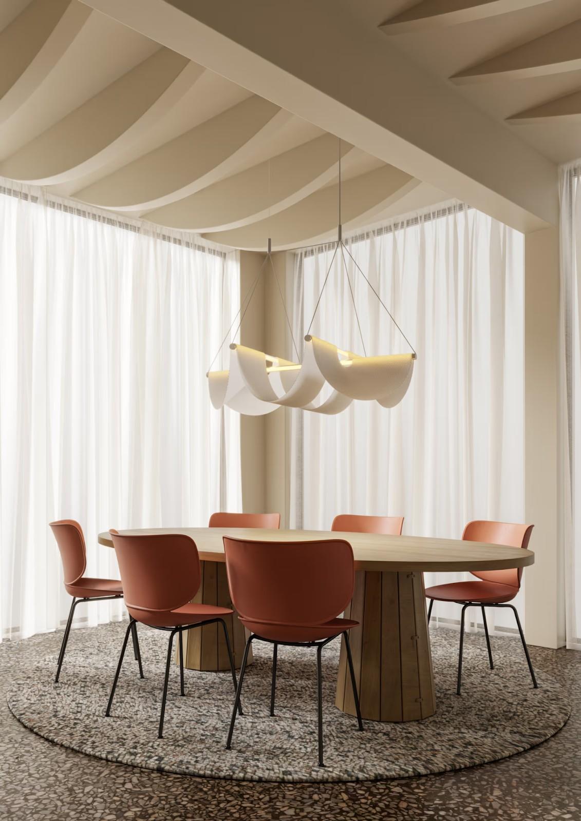 Moooi’s Drape Suspension Lights in a movement studio (left) and above a dining table (right).