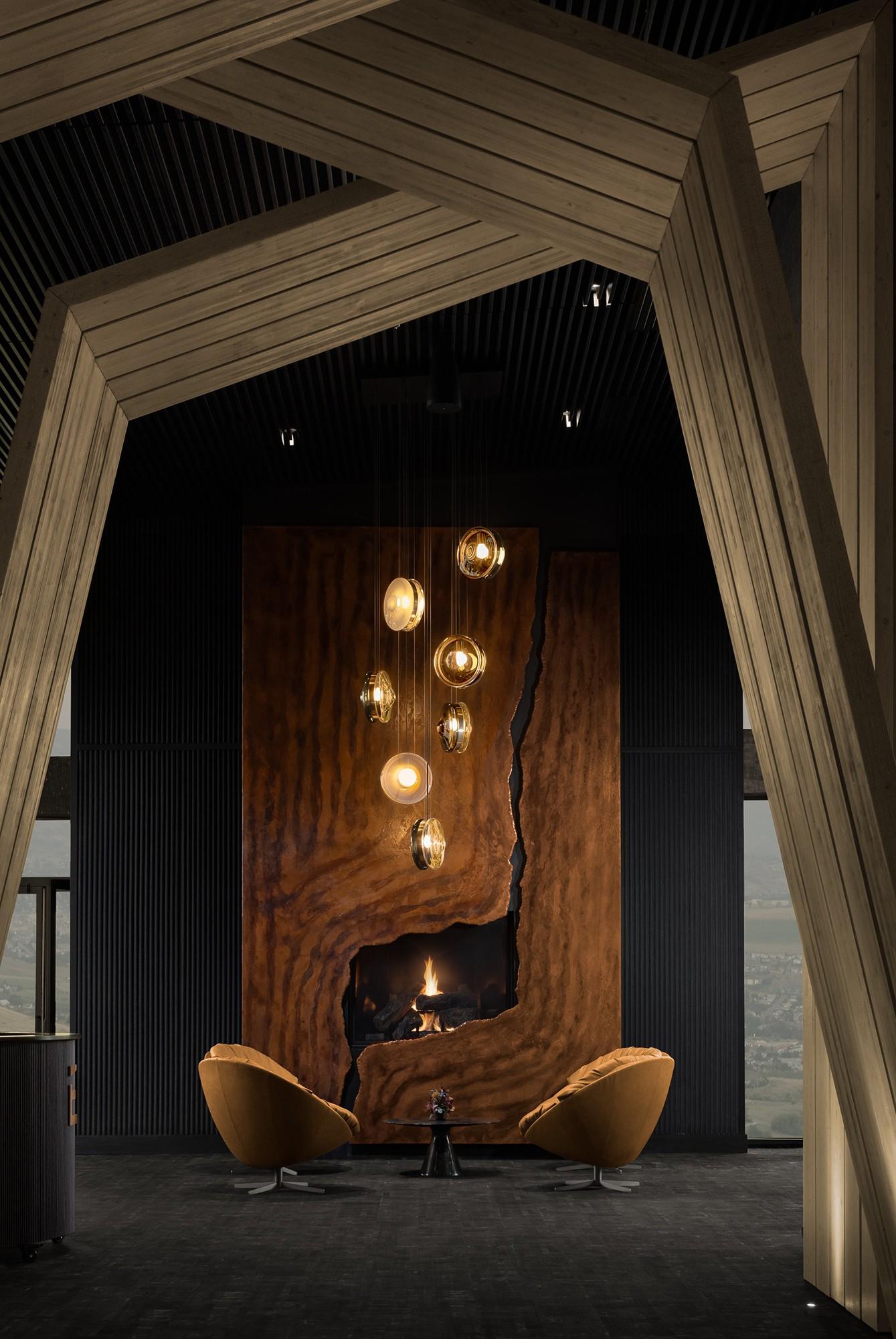 Bomma’s Orbital Pendants punctuate the fireplace lounge. Photography by Nimkat Studio.